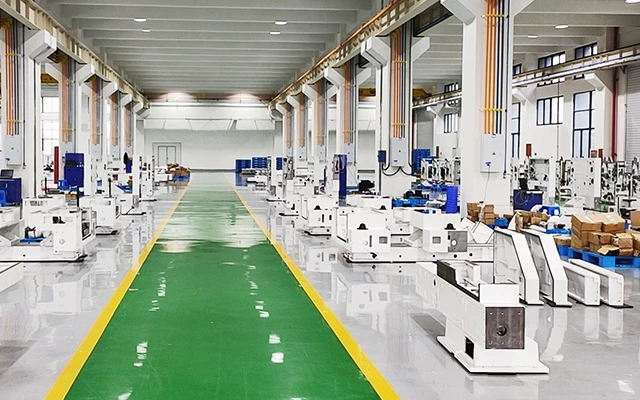 A clean full‑servo automatic bag making line with visible HMI panel and organized reel stand